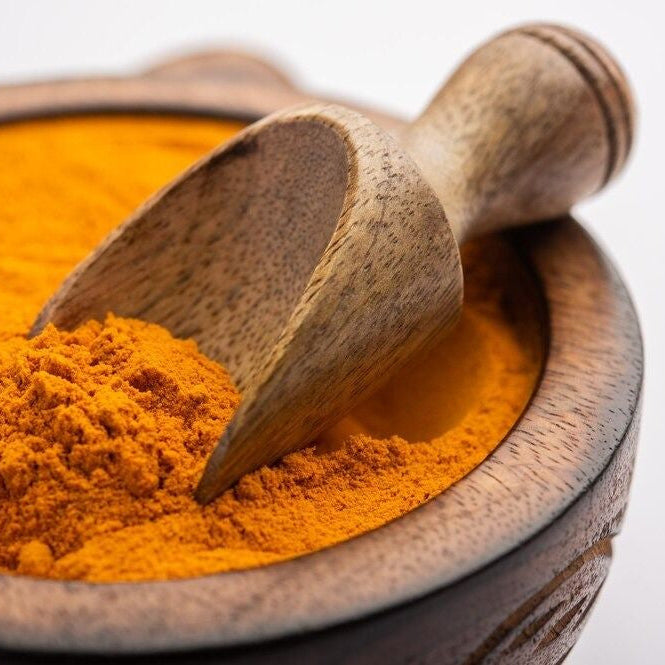 Close-up of Zee Spices Haldi showing fine golden turmeric powder