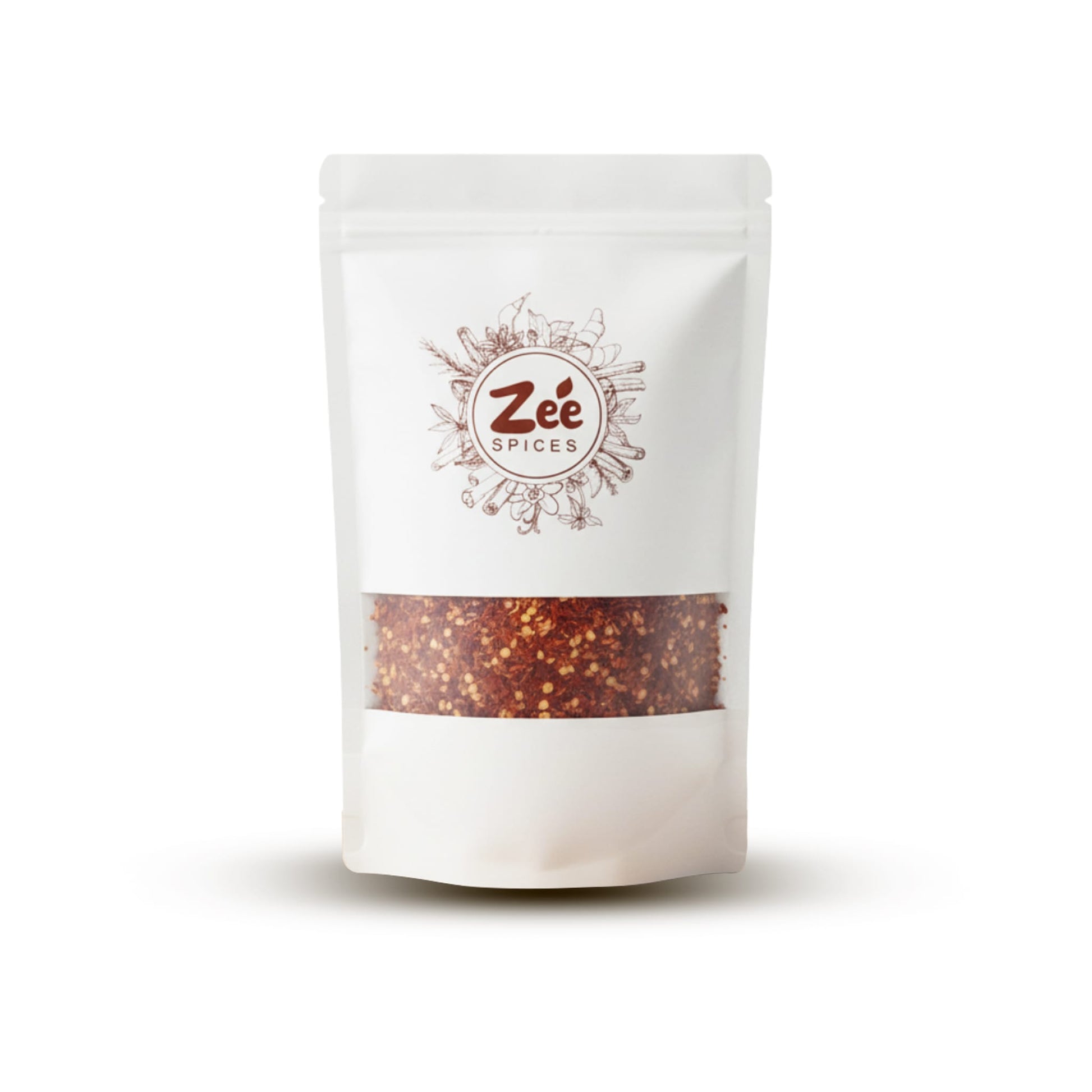 White pouch of Zee Spices on a white background with chilli flakes