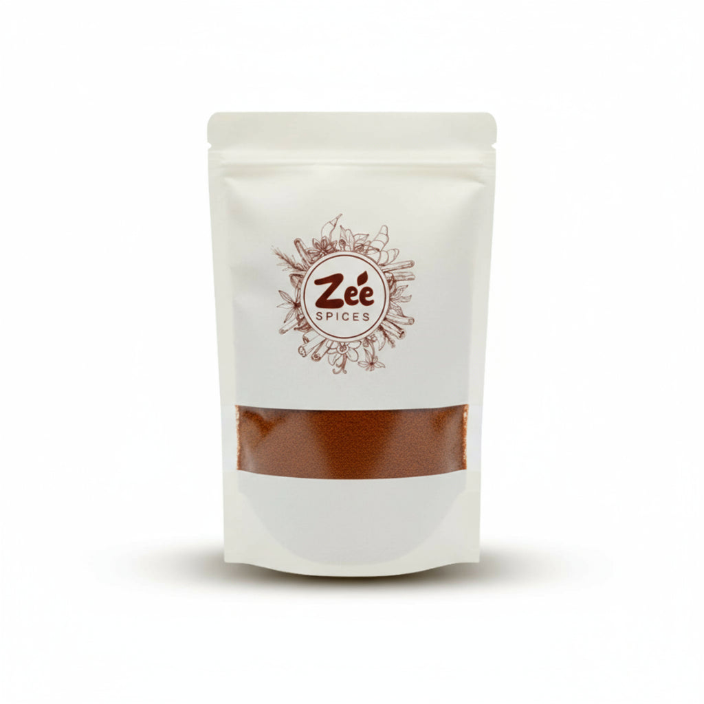 White pouch of Zée Spices on a white background include hot mixture blend