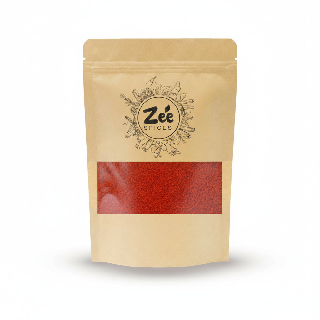 Kraft paper red chili powder package with 'Zee Spices' branding on a white background